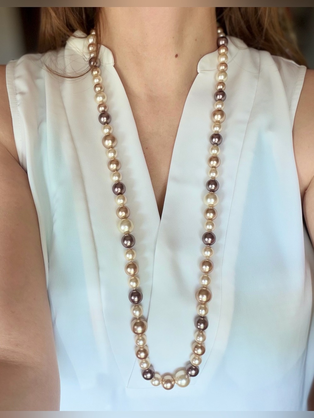 stem Burgundy Floral Top with Yellow-Accent Pattern and Pearl Necklace